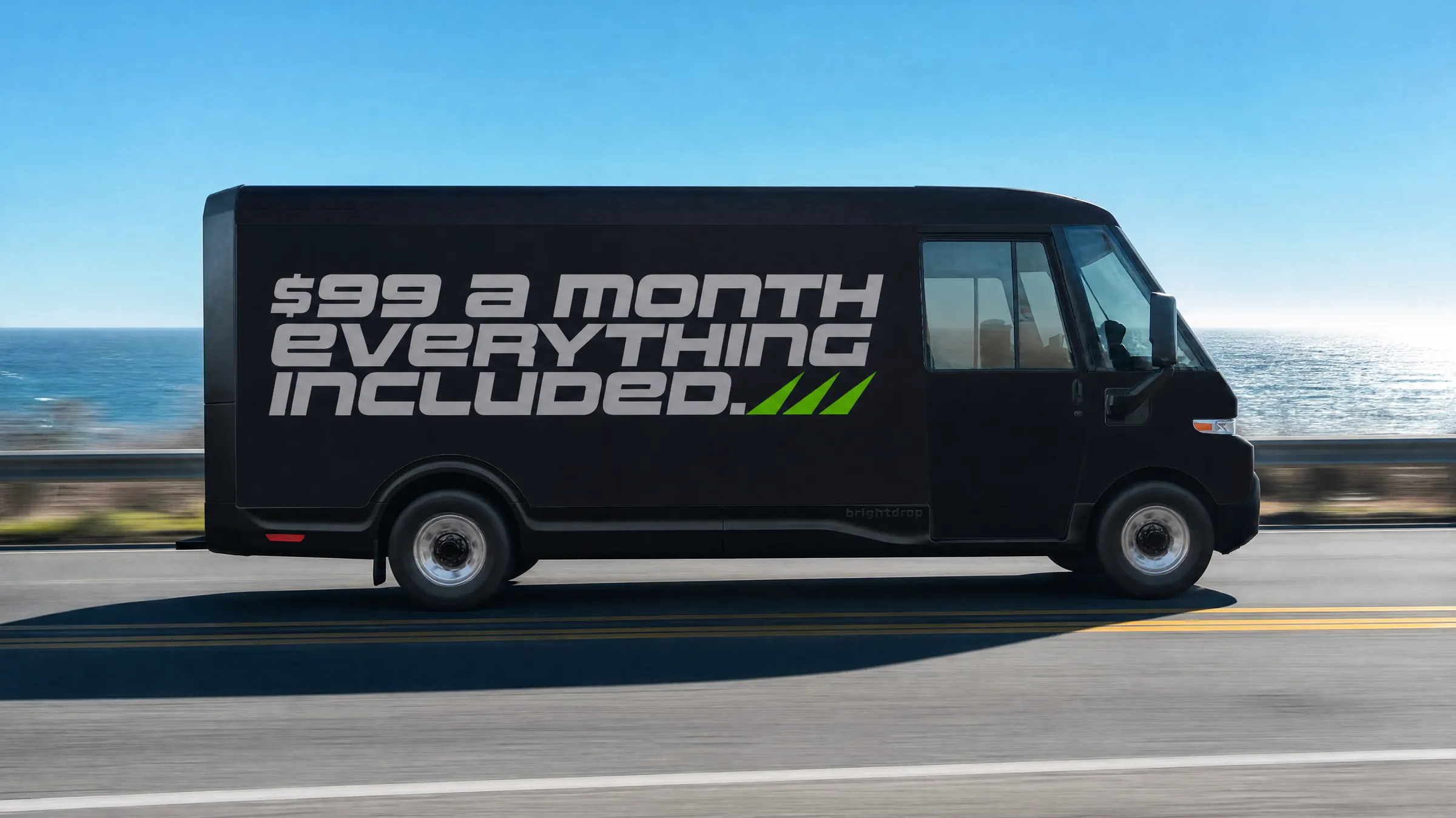A matte black wrap-shop van reading $99 EVERYTHING INCLUDED driving through a city at dusk