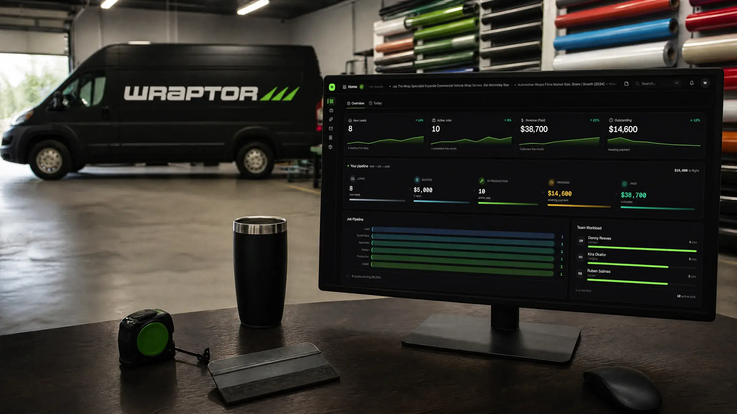 A wrap shop owner's dashboard on screen, the wrapped Wraptor van on the shop floor behind it